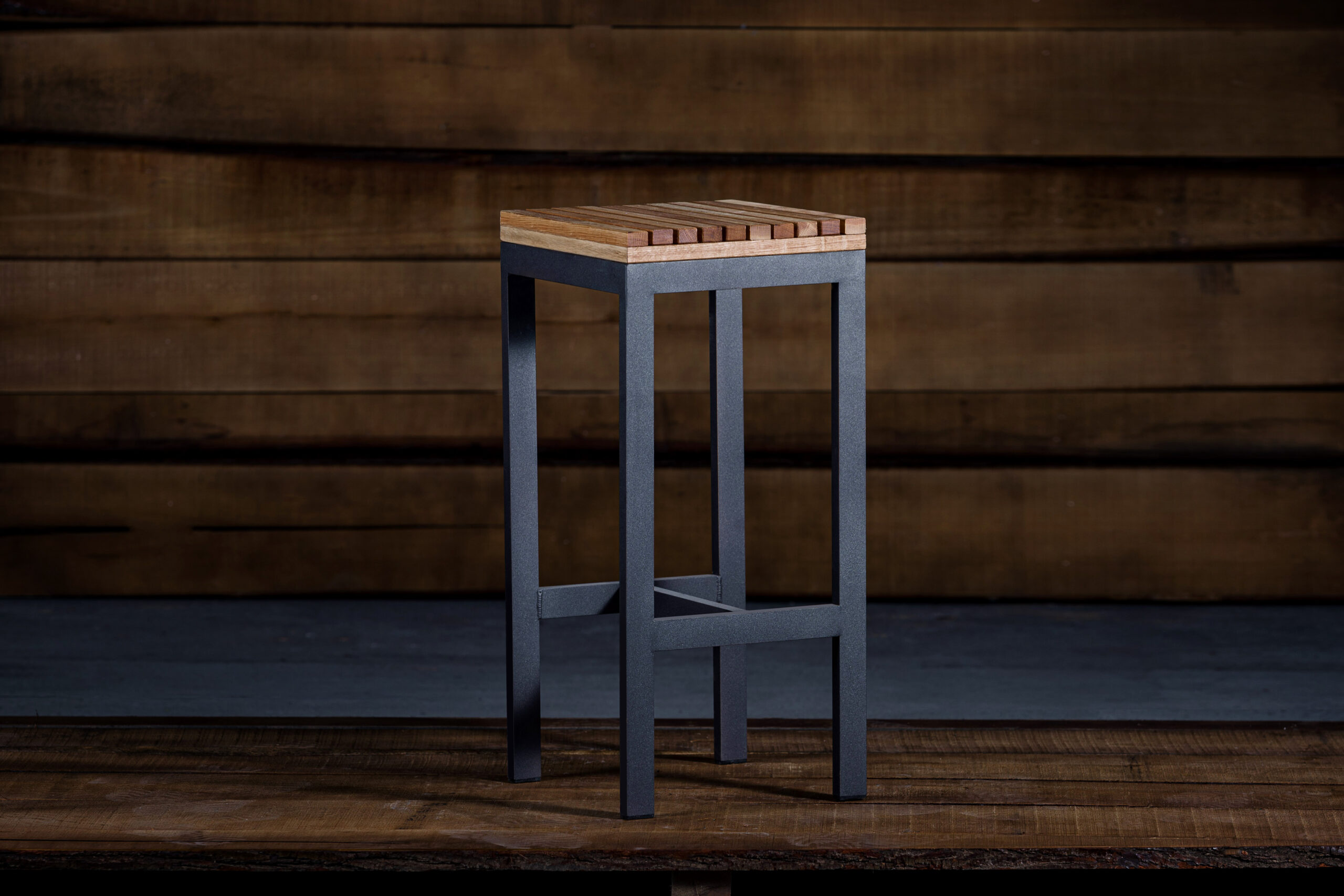 A closeup of a bar stool in loft style