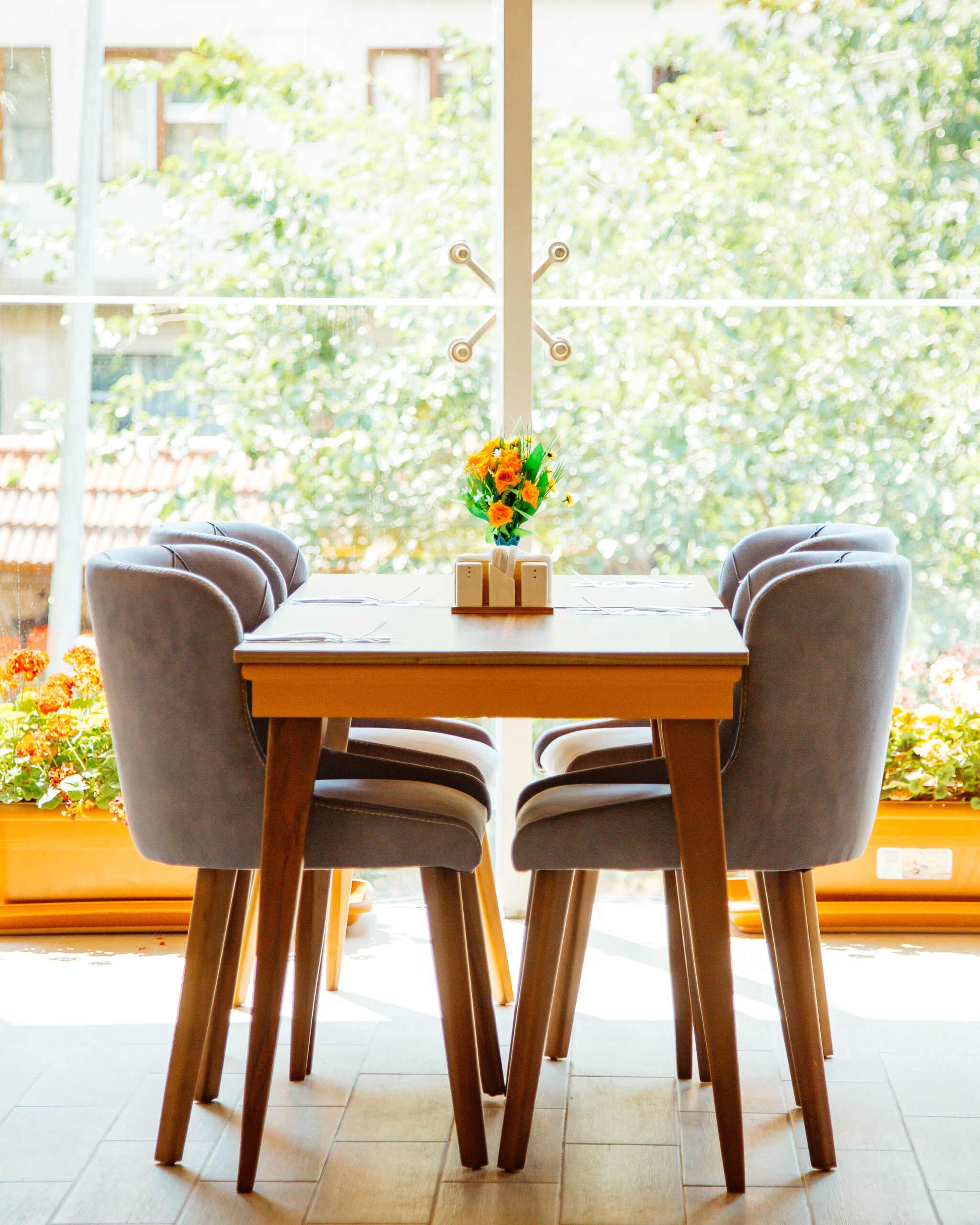 four person table in front of the window at the restaurant